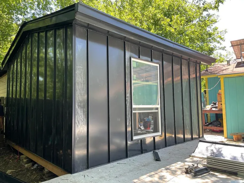 Black standing seam metal wall panels for Roof Inspection in McDonough